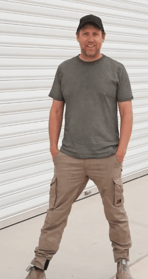 Johnny Leary in front of a shed